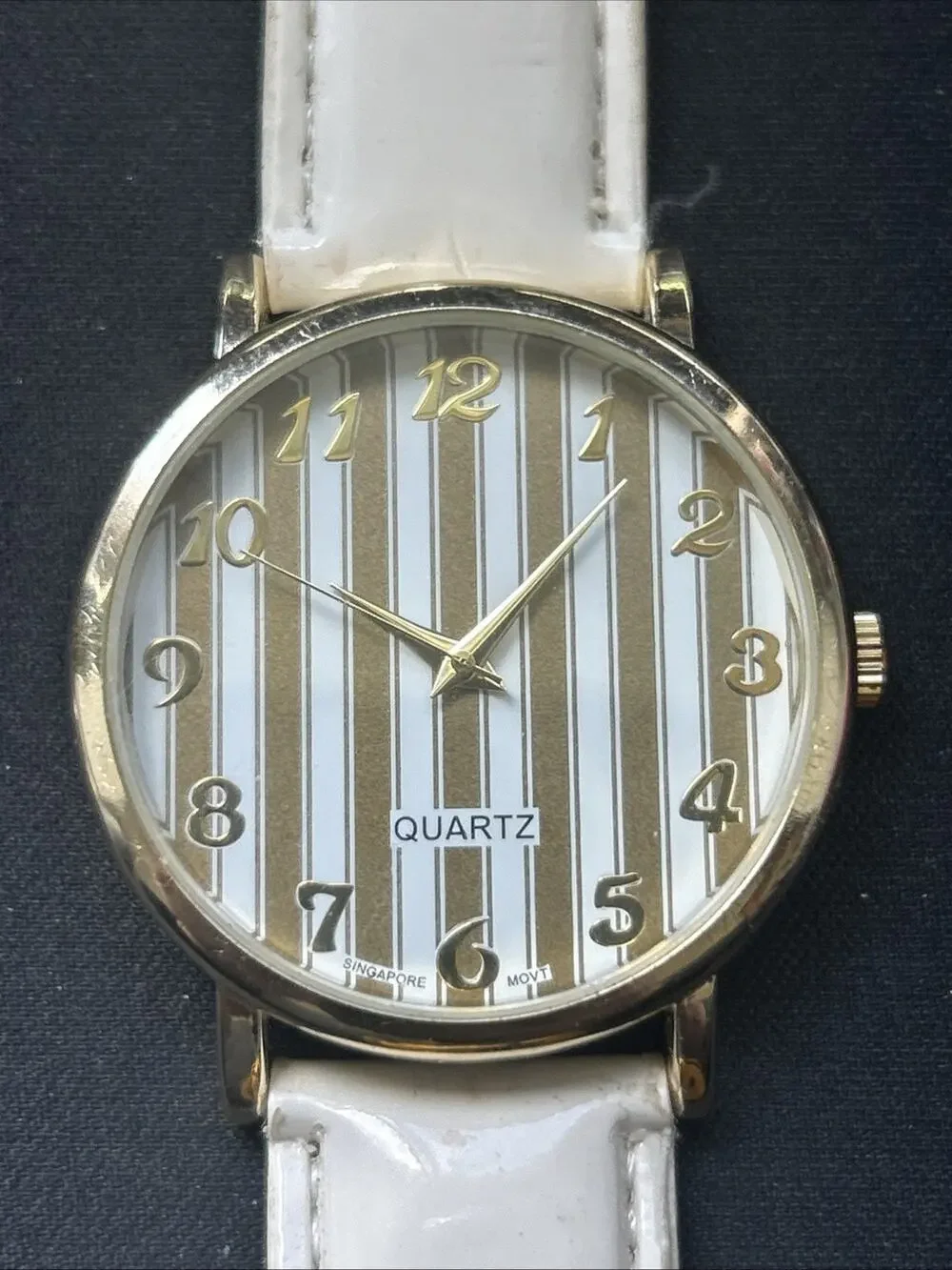 Gold Tone White Band Striped Dial Women’s Quartz Watch